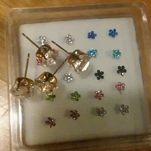 Set of nose rings. 4 diamond earrings,no backs.